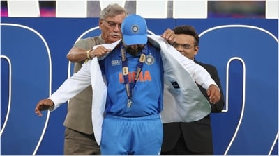 Rohit Sharma (c) presented with white blazer by Roger Binny (L) and Jay Shah (PTI) Rohit Sharma (c) presented with white blazer by Roger Binny (L) and Jay Shah (PTI)