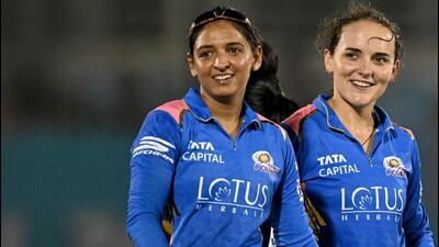 Mumbai Indians' Amelia Kerr (R) celebrates with captain Harmanpreet Kaur. (AFP) Mumbai Indians' Amelia Kerr (R) celebrates with captain Harmanpreet Kaur. (AFP)