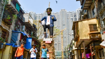 In a unique take on the Holika Dahan ritual, people in Mumbai constructed a 25-ft effigy representing a corporate figure of the Torres scam to burn instead. (PTI) In a unique take on the Holika Dahan ritual, people in Mumbai constructed a 25-ft effigy representing a corporate figure of the Torres scam to burn instead. (PTI)
