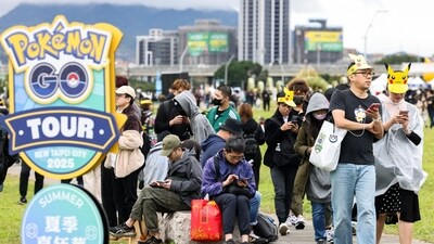 People play Pokemon Go on their smartphones during the opening day of the Pokemon Go tour at the New Taipei Metropolitan Park in New Taipei City on February 21, 2025. (I-Hwa Cheng/AFP)