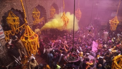 A priest throws coloured powder over Hindu devotees during 'Basant Panchami' festival celebrations, which mark the preparations for the arrival of spring, inside the Sri Bankey Bihari temple in Vrindavan. (AFP file) A priest throws coloured powder over Hindu devotees during 'Basant Panchami' festival celebrations, which mark the preparations for the arrival of spring, inside the Sri Bankey Bihari temple in Vrindavan. (AFP file)