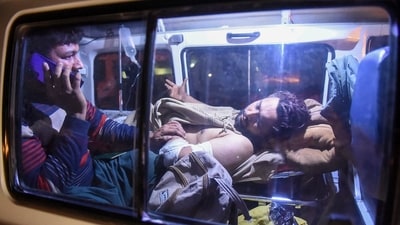 An injured train passenger is being transported following an operation against armed militants who ambushed the train in the remote mountainous area in Mach, southwestern Balochistan province on March 12, 2025. (AFP) An injured train passenger is being transported following an operation against armed militants who ambushed the train in the remote mountainous area in Mach, southwestern Balochistan province on March 12, 2025. (AFP)