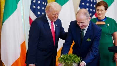 US President Donald Trump, from left, Micheal Martin, Ireland's prime minister, and his wife Mary O'Shea during a reception in the East Room of the White House in Washington, DC, US, on Wednesday, March 12, 2025. Photographer: Bonnie Cash/UPI/Bloomberg (Bloomberg) US President Donald Trump, from left, Micheal Martin, Ireland's prime minister, and his wife Mary O'Shea during a reception in the East Room of the White House in Washington, DC, US, on Wednesday, March 12, 2025. Photographer: Bonnie Cash/UPI/Bloomberg (Bloomberg)