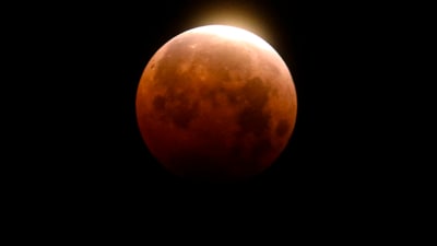 FILE - Light shines from a total lunar eclipse over Santa Monica Beach in Santa Monica, Calif., Wednesday, May 26, 2021. (AP Photo/Ringo H.W. Chiu, File) (AP) FILE - Light shines from a total lunar eclipse over Santa Monica Beach in Santa Monica, Calif., Wednesday, May 26, 2021. (AP Photo/Ringo H.W. Chiu, File) (AP)