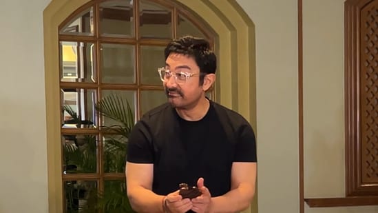 Aamir Khan feasts on a piece of cake during his birthday celebrations.