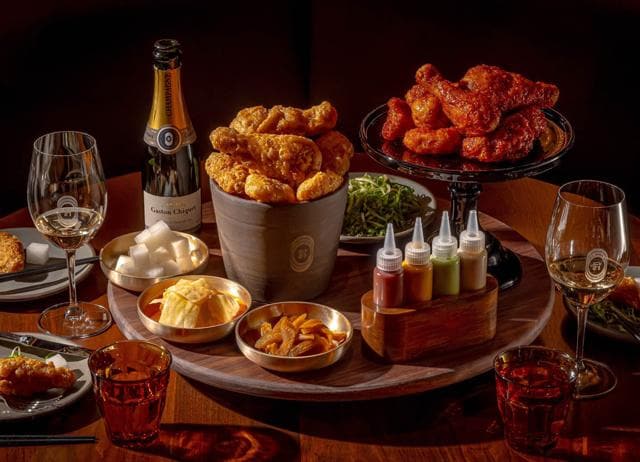 In New York, COQODAQ pairs fried chicken with champagne. In New York, COQODAQ pairs fried chicken with champagne.