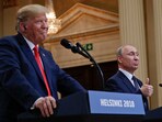 Russian President Vladimir Putin, right, and US President Donald Trump give a joint news conference at the Presidential Palace in Helsinki, Finland.