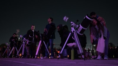 Skygazers watch the full moon eclipse at Galileo Galilei Planetarium in Buenos Aires on March 14, 2025. (AFP) Skygazers watch the full moon eclipse at Galileo Galilei Planetarium in Buenos Aires on March 14, 2025. (AFP)