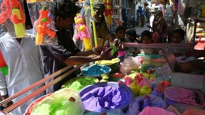 Local Hindu residents buy colour powders to celebrate the Hindu festival of Holi in Tharparkar district of the desert town of Mithi, south-eastern Pakistan. (AFP)