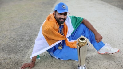 India captain Rohit Sharma with the Champions Trophy (AP) India captain Rohit Sharma with the Champions Trophy (AP)