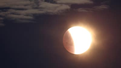 The moon is seen as a section moves into shadow during a lunar eclipse, photographed near Stonehenge stone circle, Amesbury, southern Britain, March 14, 2025. (REUTERS) The moon is seen as a section moves into shadow during a lunar eclipse, photographed near Stonehenge stone circle, Amesbury, southern Britain, March 14, 2025. (REUTERS)