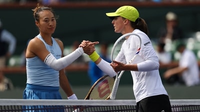 Iga Swiatek (R) shakes hands with Qinwen Zheng (L). (AFP) Iga Swiatek (R) shakes hands with Qinwen Zheng (L). (AFP)