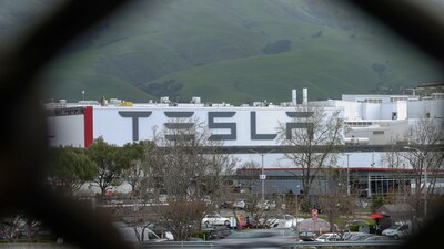 Tesla said in its letter that it supports fair trade, (AP) Tesla said in its letter that it supports fair trade, (AP)