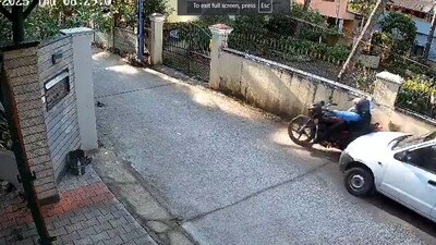 Screengrab from viral video where a BSNL employee rammed his car into a biker. (X) Screengrab from viral video where a BSNL employee rammed his car into a biker. (X)