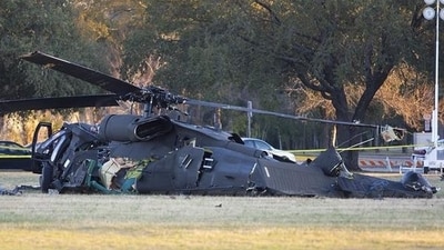 Early Friday, a helicopter fell into a reservoir in northern Ohio after striking a power line, killing the pilot. (AP)