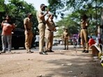 Police officers stand at the crime scene next to markings of the gunshots where Nationalist Congress Party (NCP) politician Baba Siddique was shot dead in Mumbai, India, October 13, 2024.