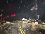 Debris covers the road during a severe storm passed the area north of Seymour, Mo., in Webster County late Friday, Debris covers the road during a severe storm passed the area north of Seymour, Mo., in Webster County late Friday,