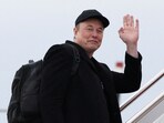 Elon Musk and his son X Æ A-12 board Air Force One at Joint Base Andrews in Maryland, U.S., March 14, 2025.  REUTERS/Kevin Lamarque