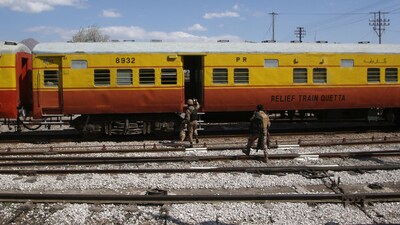 Soldiers board a relief train headed to Bolan, where a passenger train was attacked by separatist militants, at a railway station in Mach, Balochistan, Pakistan. (REUTERS)