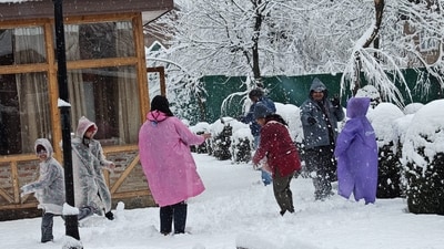 Tourists play with snow after a fresh spell of snowfall, in Pahalgam, Jammu and Kashmir, Saturday, March 15, 2025. (PTI) Tourists play with snow after a fresh spell of snowfall, in Pahalgam, Jammu and Kashmir, Saturday, March 15, 2025. (PTI)