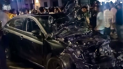 A look at the wrecked car following its collision with a two-wheeler in Vadodara on Thursday. One woman lost her life in the accident. (ANI) A look at the wrecked car following its collision with a two-wheeler in Vadodara on Thursday. One woman lost her life in the accident. (ANI)
