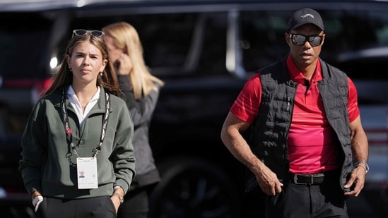 Kai Trump (L) and Tiger Woods arrive to the course during the final round of The Genesis Invitational 2025 at Torrey Pines Golf Course on February 16, 2025 in La Jolla, California. Michael Owens/Getty Images/AFP (Getty Images via AFP)