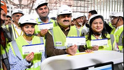 Gautam Adani (centre), chairman of the Adani group, visited the airport on Sunday. Gautam Adani (centre), chairman of the Adani group, visited the airport on Sunday.
