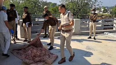 Police officials at the crime spot in Charkhi Dadri where a man and woman were found dead in the woman’s house. (HT Photo)