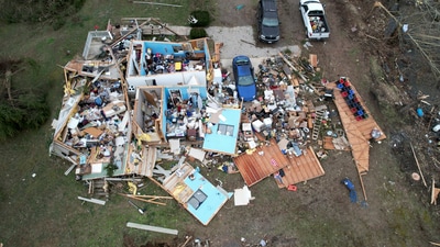 The storm has left 32 people dead across the country, as well as several injured and caused many homes to fall apart (Jeff Robertson/AP) The storm has left 32 people dead across the country, as well as several injured and caused many homes to fall apart (Jeff Robertson/AP)