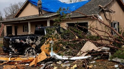 People have been helping each other cover and fix the damaged homes and clear out debris (Getty Images via AFP) People have been helping each other cover and fix the damaged homes and clear out debris (Getty Images via AFP)