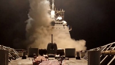 A ship fires missiles at an undisclosed location, after President Donald Trump launched military strikes against Yemen's Iran-aligned Houthis on Saturday. (REUTERS)