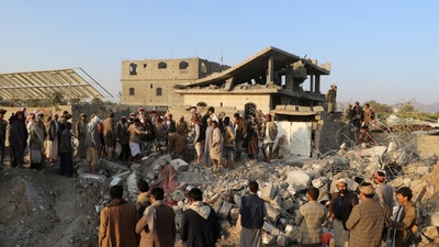 People gather at the site of a house hit by a U.S. strike in Saada, Yemen March 16, 2025. (Reuters)