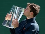 Jack Draper of Great Britain poses with the trophy after defeating Holger Rune of Denmark during the men's final of the BNP Paribas Open