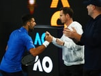 Serbia's Novak Djokovic celebrates with his coach Andy Murray after winning his quarter final match against Spain's Carlos Alcaraz.