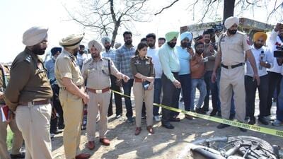 Amritsar police commissioner Gurpreet Singh Bhullar (second from left) with other officials at the encounter site at Rajasansi in Amritsar on Monday. (Sameer Sehgal/HT) Amritsar police commissioner Gurpreet Singh Bhullar (second from left) with other officials at the encounter site at Rajasansi in Amritsar on Monday. (Sameer Sehgal/HT)