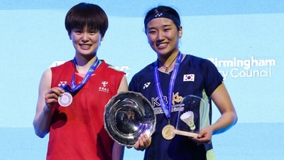Winner South Korea's An Se Young (R) celebrates with trophy during the podium ceremony after winning against China's Wang Zhi Yi (L) at the end of the Women's Singles Final at the All England Open. (AFP) Winner South Korea's An Se Young (R) celebrates with trophy during the podium ceremony after winning against China's Wang Zhi Yi (L) at the end of the Women's Singles Final at the All England Open. (AFP)