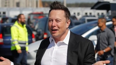 Tesla CEO Elon Musk gestures as he arrives to visit the construction site of the US electric car giant Tesla, on September 3, 2020 in Gruenheide near Berlin, northeastern Germany. (AFP)