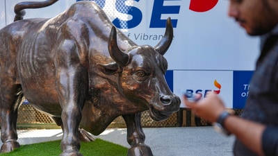 Stock market news: A man walks past the bull statue at BSE building in Mumbai. (PTI) Stock market news: A man walks past the bull statue at BSE building in Mumbai. (PTI)