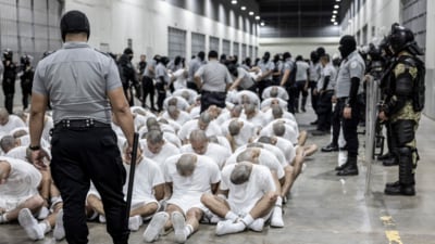 A prison guard transfers deportees from the U.S., alleged to be Venezuelan gang members, to the Terrorism Confinement Center in Tecoluca, El Salvador, Sunday, March 16, 2025. (AP) A prison guard transfers deportees from the U.S., alleged to be Venezuelan gang members, to the Terrorism Confinement Center in Tecoluca, El Salvador, Sunday, March 16, 2025. (AP)