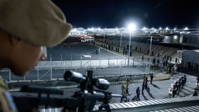 A sniper takes aim to Venezuelan deportees. The 1798 Alien Enemies Act has been invoked only three times in US history, deports people suspected to be illegal immigrants without an opportunity to be heard before an immigration or federal court judge. (REUTERS)