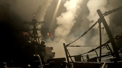 A ship fires missiles at an undisclosed location, after U.S. President Donald Trump launched military strikes against Yemen's Iran-aligned Houthis on Saturday over the group's attacks against Red Sea shipping. (REUTERS)
