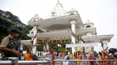 A CRPF personnel stands guard outside the gate of the Vaishno Devi shrine in Katra, Jammu. (PTI File Photo)