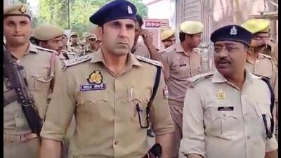 ASP Shrish Chandra and DSP Anuj Chaudhary led a flag march in Sambhal district of Uttar Pradesh on March 18. (Sourced) ASP Shrish Chandra and DSP Anuj Chaudhary led a flag march in Sambhal district of Uttar Pradesh on March 18. (Sourced)