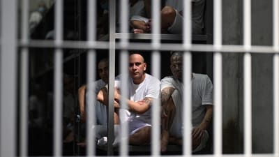 Inmates look on as they remain in a cell at the Counter-Terrorism Confinement Centre (CECOT) mega-prison. (AFP) Inmates look on as they remain in a cell at the Counter-Terrorism Confinement Centre (CECOT) mega-prison. (AFP)