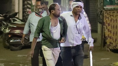 Nagpur violence: Police personnel detain a protestor after a clash broke out between two groups in the Mahal area in Nagpur on Monday. (ANI) Nagpur violence: Police personnel detain a protestor after a clash broke out between two groups in the Mahal area in Nagpur on Monday. (ANI)