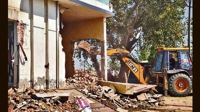 Rural police conducted the demolition in the presence of panchayat officials. Heavy police security was ensured to prevent any untoward incident. (HT Photo)