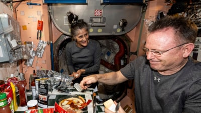 NASA, astronauts Suni Williams and Butch Wilmore, both Expedition 71 Flight Engineers, make pizza aboard the International Space Station's galley located inside the Unity module on Sept. 9, 2024. (AP File)