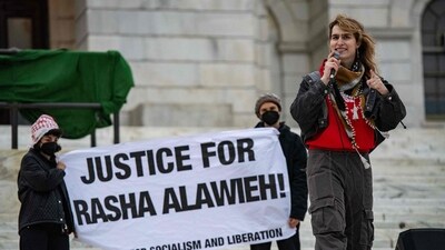 Maya Lehrer, an organiser with the party for socialism and liberation, speaks during a protest against the deportation of assistant pofessor of medicine Dr Rasha Alawieh of Brown University at the State House in Providence, (AFP) Maya Lehrer, an organiser with the party for socialism and liberation, speaks during a protest against the deportation of assistant pofessor of medicine Dr Rasha Alawieh of Brown University at the State House in Providence, (AFP)