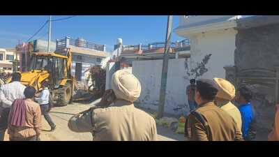 Under the Punjab government’s “Yudh Nasheyan Virudh” (war against drugs) mission, the Sangrur police, acting on administrative orders, demolished two houses in Ram Basti on Tuesday, targeting individuals with extensive drug trafficking records. (HT Photo)