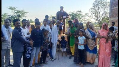 Villagers celebrate at the statue of Dr Bhimrao Ambedkar in Dehuli, after the court awarded death sentence to three convicts on Tuesday. (HT Photo) Villagers celebrate at the statue of Dr Bhimrao Ambedkar in Dehuli, after the court awarded death sentence to three convicts on Tuesday. (HT Photo)